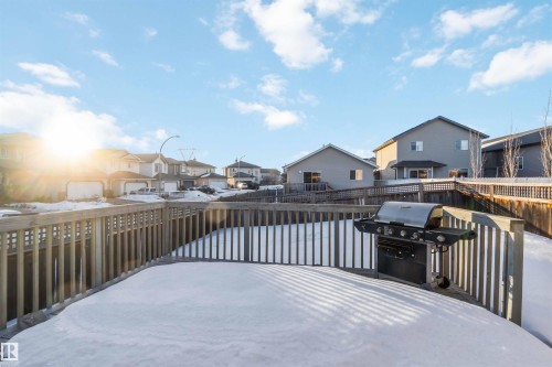 Snow covered deck featuring a residential view and area for grilling - 4507 164A Avenue, Edmonton, AB - Outdoor With Exterior