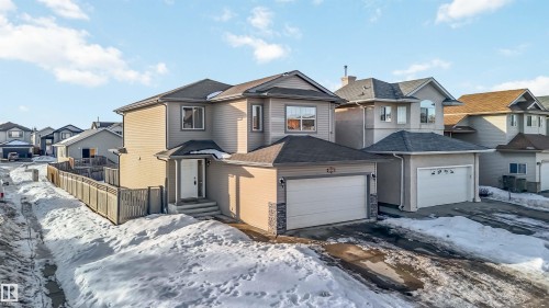 View of front facade with a residential view and a shingled roof - 4507 164A Avenue, Edmonton, AB - Outdoor With Facade