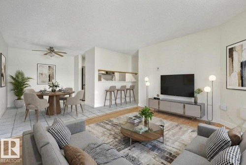 Living area featuring ceiling fan, wood finished floors, and a textured ceiling - #117 5005 31 Avenue, Edmonton, AB - Indoor Photo Showing Living Room