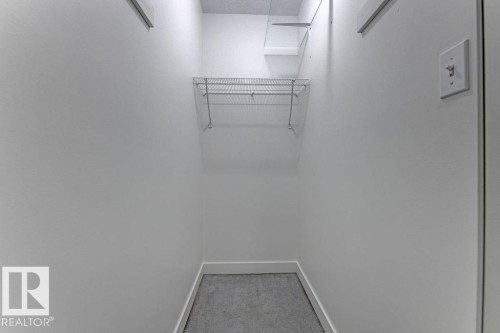 Walk in closet featuring light colored carpet - #117 5005 31 Avenue, Edmonton, AB - Indoor With Storage