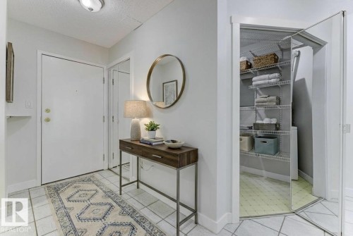 Foyer featuring a textured ceiling and baseboards - #117 5005 31 Avenue, Edmonton, AB - Indoor Photo Showing Other Room