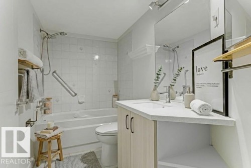 Bathroom featuring vanity and shower / bathtub combination - #117 5005 31 Avenue, Edmonton, AB - Indoor Photo Showing Bathroom