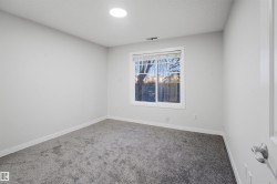 Spare room with carpet and baseboards - 