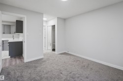 Unfurnished bedroom with ensuite bath, light carpet, and a closet - 