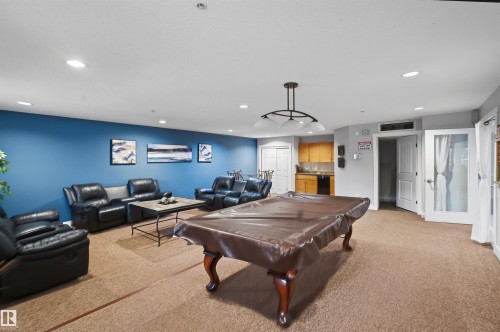 Snow covered property with a view of apartment building / complex - 115 2098 Blackmud Creek Drive, Edmonton, AB - Outdoor With Balcony With Facade