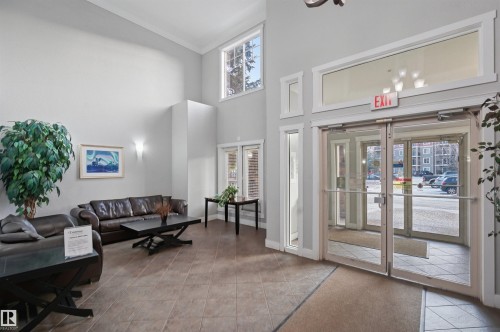 Building lobby featuring recessed lighting and a high ceiling - 115 2098 Blackmud Creek Drive, Edmonton, AB - Indoor Photo Showing Other Room