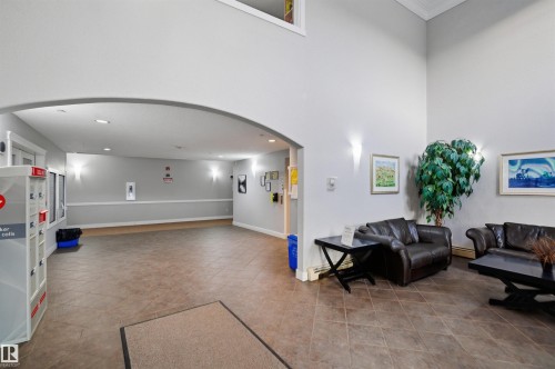 Hall with carpet and a textured wall - 115 2098 Blackmud Creek Drive, Edmonton, AB - Indoor Photo Showing Other Room