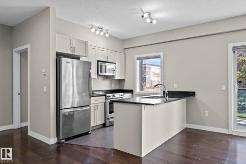 114 1230 Windermere Way Sw, Edmonton, AB - Indoor Photo Showing Kitchen With Stainless Steel Kitchen With Upgraded Kitchen