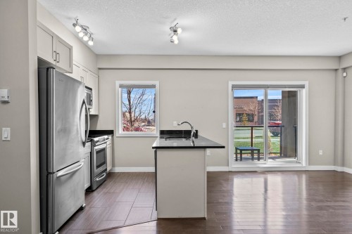 114 1230 Windermere Way Sw, Edmonton, AB - Indoor Photo Showing Kitchen With Stainless Steel Kitchen