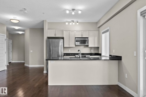 114 1230 Windermere Way Sw, Edmonton, AB - Indoor Photo Showing Kitchen With Stainless Steel Kitchen