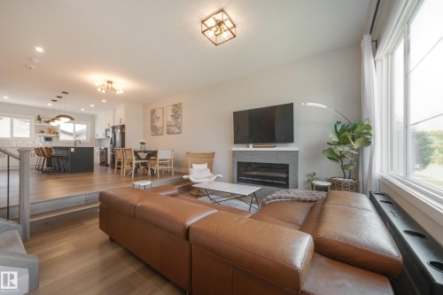 205 Caledonia Drive, Leduc, AB - Indoor Photo Showing Living Room With Fireplace