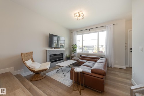 205 Caledonia Drive, Leduc, AB - Indoor Photo Showing Living Room With Fireplace