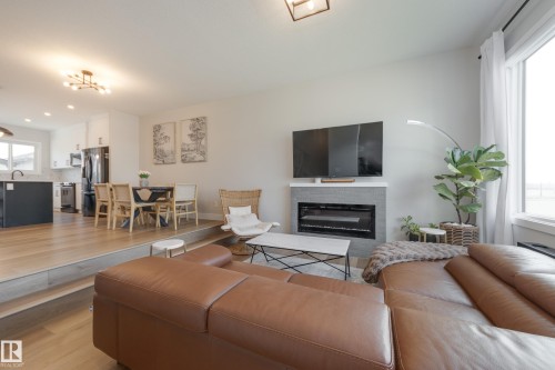 205 Caledonia Drive, Leduc, AB - Indoor Photo Showing Living Room With Fireplace