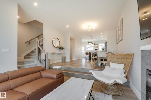 205 Caledonia Drive, Leduc, AB - Indoor Photo Showing Living Room With Fireplace