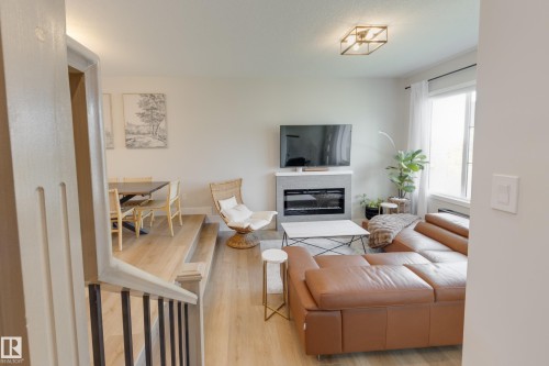 205 Caledonia Drive, Leduc, AB - Indoor Photo Showing Other Room With Fireplace