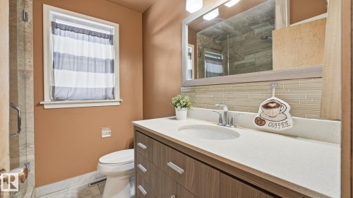 Bathroom with a stall shower, backsplash, and vanity - 11520 78 Avenue Nw, Edmonton, AB - Indoor Photo Showing Bathroom