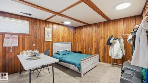Bedroom with carpet flooring and wood walls - 11520 78 Avenue Nw, Edmonton, AB - Indoor Photo Showing Other Room