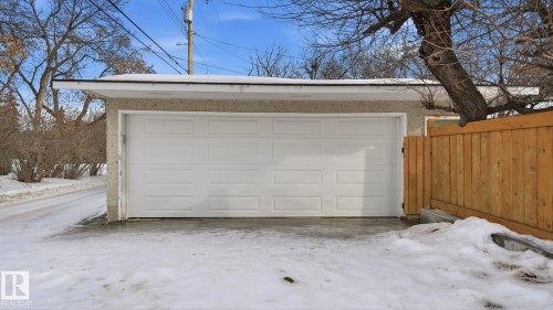 Snow covered garage with a detached garage - 11520 78 Avenue Nw, Edmonton, AB - Outdoor With Exterior