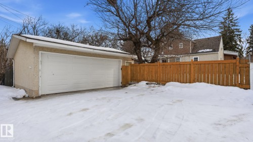 Snow covered garage with a garage - 11520 78 Avenue Nw, Edmonton, AB - Outdoor