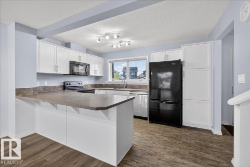 279 Southfork Drive, Leduc, AB - Indoor Photo Showing Kitchen With Double Sink