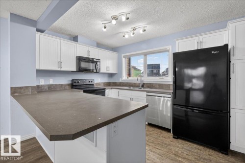 279 Southfork Drive, Leduc, AB - Indoor Photo Showing Kitchen With Double Sink