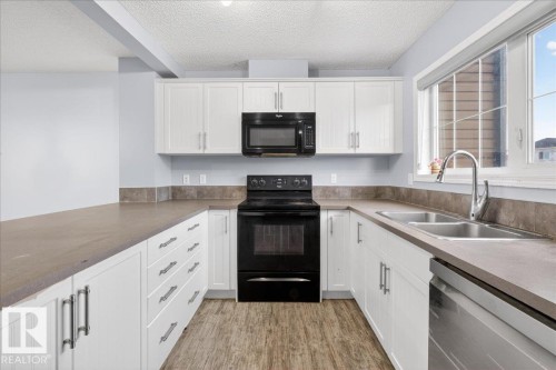 279 Southfork Drive, Leduc, AB - Indoor Photo Showing Kitchen With Double Sink