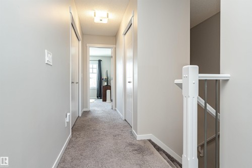Corridor featuring light colored carpet and a textured ceiling - 4008 Allan Crescent, Edmonton, AB - Indoor Photo Showing Other Room