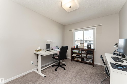 Office space featuring light colored carpet and a textured ceiling - 4008 Allan Crescent, Edmonton, AB - Indoor Photo Showing Office