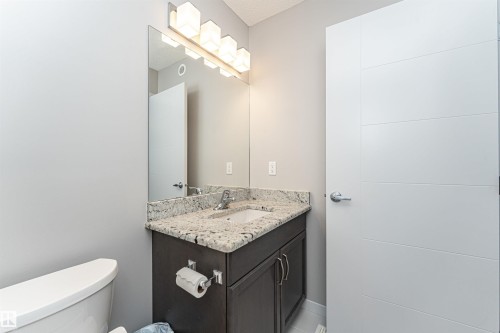 Half bath featuring vanity and toilet - 4008 Allan Crescent, Edmonton, AB - Indoor Photo Showing Bathroom
