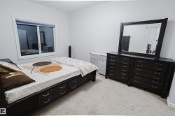 Bedroom with light colored carpet - 