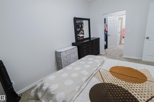Bedroom featuring light colored carpet and baseboards - 415 2203 44 Avenue, Edmonton, AB - Indoor Photo Showing Bedroom