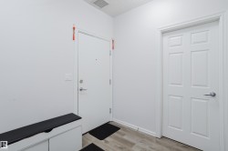 Entryway with wood finished floors - 