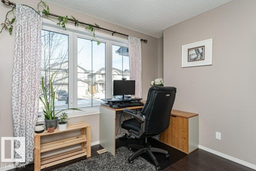 Home office featuring a textured ceiling and dark wood-style floors - 6649 Cardinal Road Sw, Edmonton, AB - Indoor Photo Showing Office