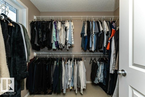 Walk in closet featuring carpet floors - 6649 Cardinal Road Sw, Edmonton, AB - Indoor With Storage