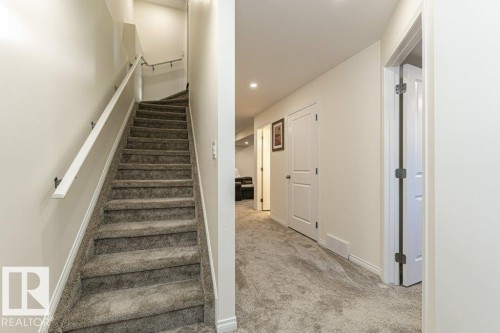 Staircase with carpet floors and recessed lighting - 6649 Cardinal Road Sw, Edmonton, AB - Indoor Photo Showing Other Room