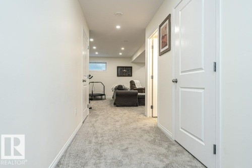Corridor featuring recessed lighting and light carpet - 6649 Cardinal Road Sw, Edmonton, AB - Indoor Photo Showing Other Room