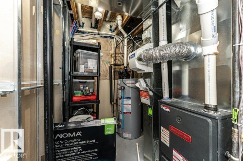 Utilities with heating unit and gas water heater - 6649 Cardinal Road Sw, Edmonton, AB - Indoor Photo Showing Basement