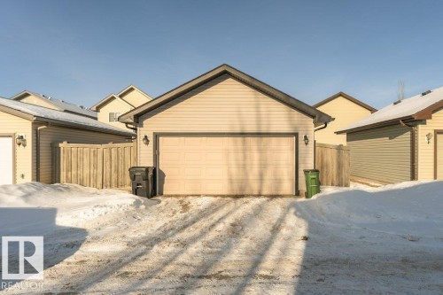 View of front of home featuring an outdoor structure and a detached garage - 6649 Cardinal Road Sw, Edmonton, AB - Outdoor With Exterior