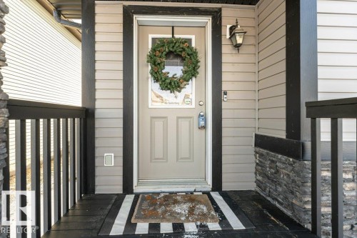 View of exterior entry - 6649 Cardinal Road Sw, Edmonton, AB - Outdoor With Exterior