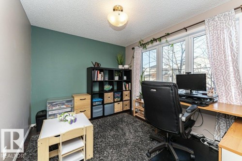 Office featuring baseboards and a textured ceiling - 6649 Cardinal Road Sw, Edmonton, AB - Indoor Photo Showing Office