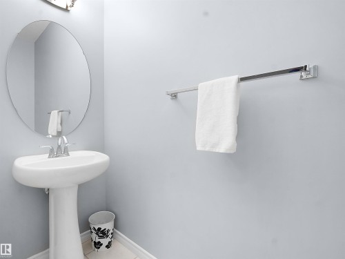 Bathroom with baseboards and tile patterned floors - 6115 11 Avenue, Edmonton, AB - Indoor Photo Showing Bathroom