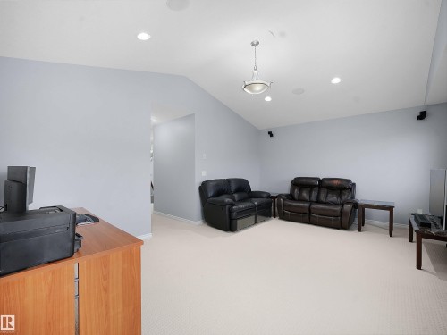 Carpeted bonus room featuring vaulted ceiling and recessed lighting - 6115 11 Avenue, Edmonton, AB - Indoor
