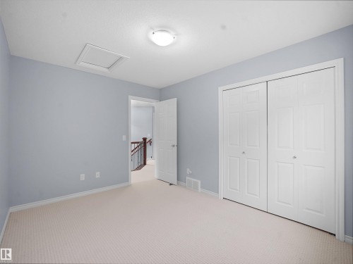 Unfurnished bedroom featuring carpet flooring and a closet - 6115 11 Avenue, Edmonton, AB - Indoor Photo Showing Other Room