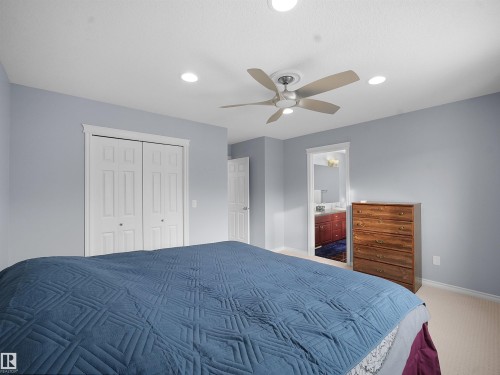Carpeted bedroom with a closet, recessed lighting, ceiling fan, and ensuite bath - 6115 11 Avenue, Edmonton, AB - Indoor Photo Showing Bedroom