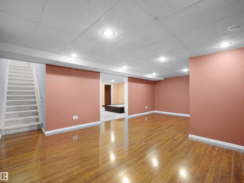 Finished basement with a paneled ceiling, recessed lighting, and light wood-type flooring - 6115 11 Avenue, Edmonton, AB - Indoor Photo Showing Other Room