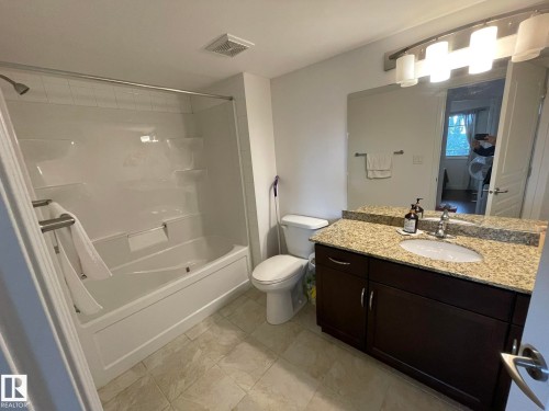 Bathroom featuring vanity and tub / shower combination - 207 7021 South Terwillegar Drive, Edmonton, AB - Indoor Photo Showing Bathroom