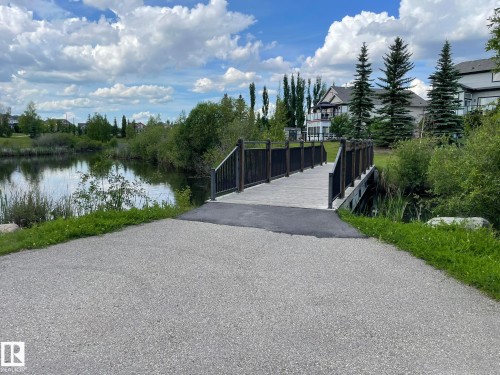 Gate with a water view - 207 7021 South Terwillegar Drive, Edmonton, AB - Outdoor With Body Of Water