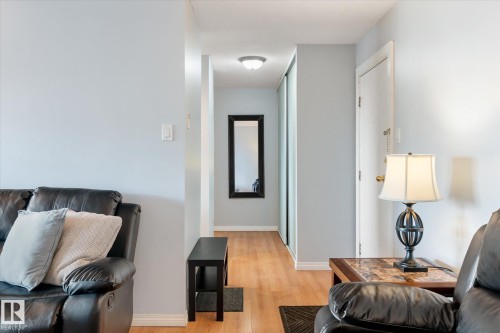Living area with light wood-type flooring and baseboards - 304 9725 106 Street, Edmonton, AB - Indoor Photo Showing Other Room