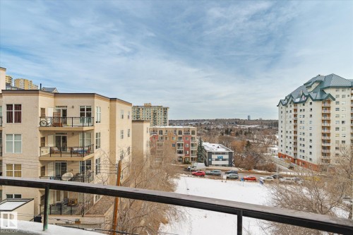 Snow covered back of property with grilling area - 304 9725 106 Street, Edmonton, AB - Outdoor