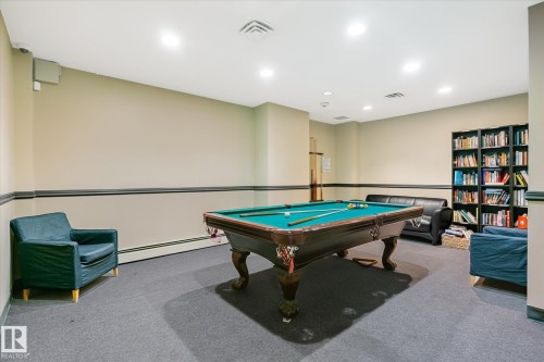Rec room featuring pool table, recessed lighting, and a baseboard heating unit - 304 9725 106 Street, Edmonton, AB - Indoor Photo Showing Other Room